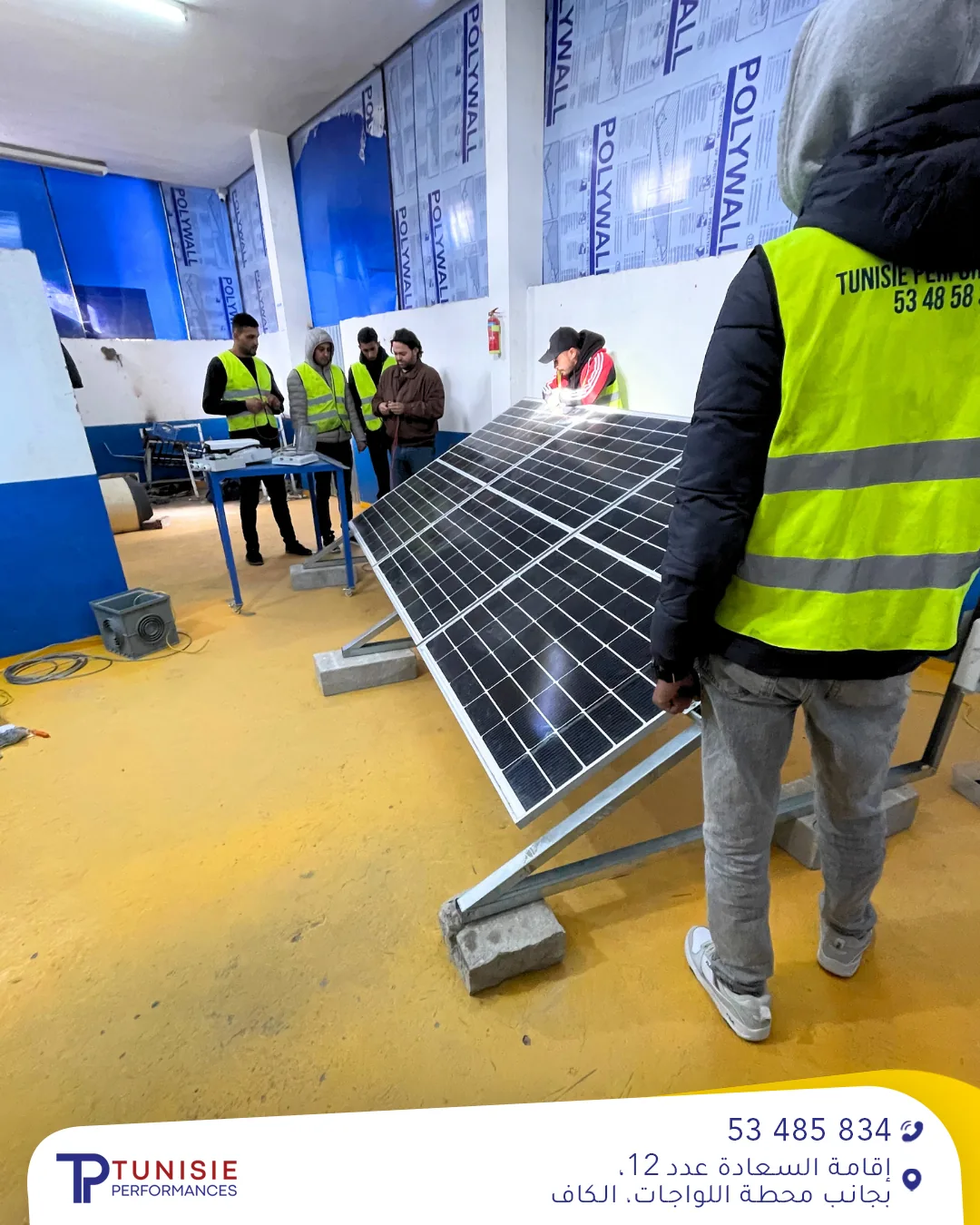 Trainees in the solar panel workshop